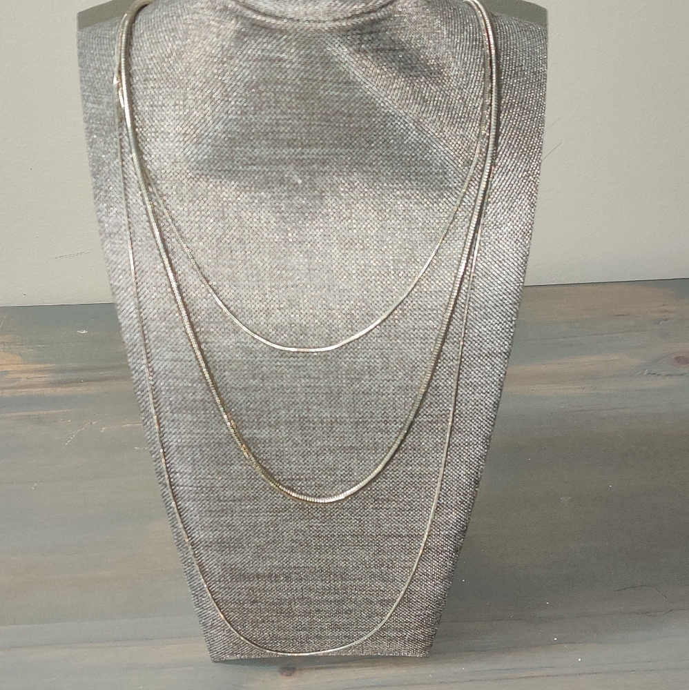 Long, silver 3 tier chain